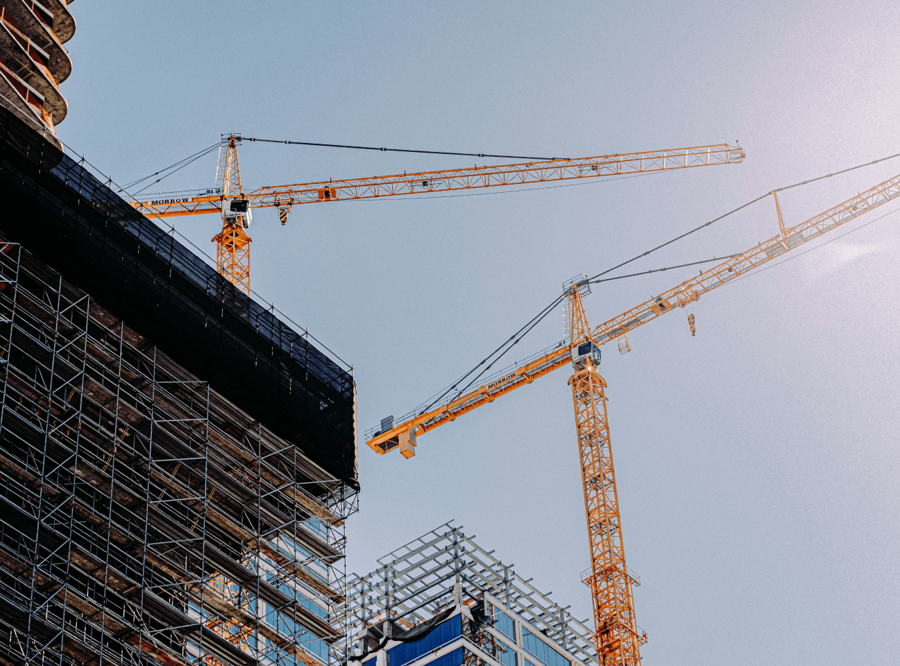 two cranes above skyline